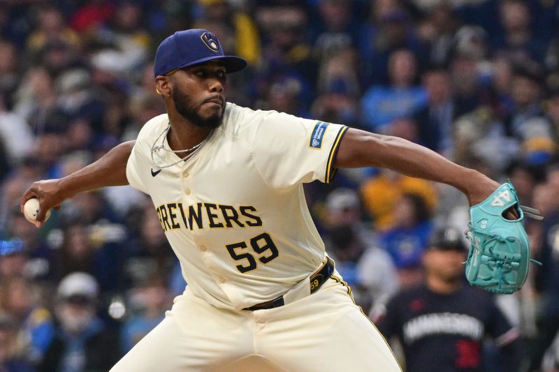 Apr 2, 2024; Milwaukee, Wisconsin, USA; Milwaukee Brewers pitcher Elvis Peguero (59) pitches against the Minnesota Twins in the sixth inning at American Family Field. Mandatory Credit: Benny Sieu-USA TODAY Sports