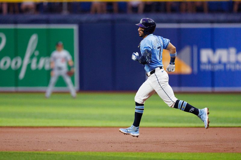 Jun 30, 2024; St. Petersburg, Florida, USA;  Tampa Bay Rays shortstop Jose Caballero (7) runs the bases after hitting a two-run home run against the Washington Nationals in the second inning at Tropicana Field. Mandatory Credit: Nathan Ray Seebeck-USA TODAY Sports