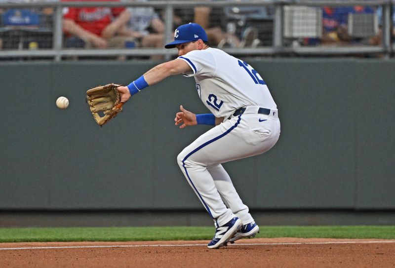 Jun 27, 2024; Kansas City, Missouri, USA; Kansas City Royals third baseman Nick Loftin (12) fields the ball in the fourth inning against the Cleveland Guardians at Kauffman Stadium. Mandatory Credit: Peter Aiken-USA TODAY Sports