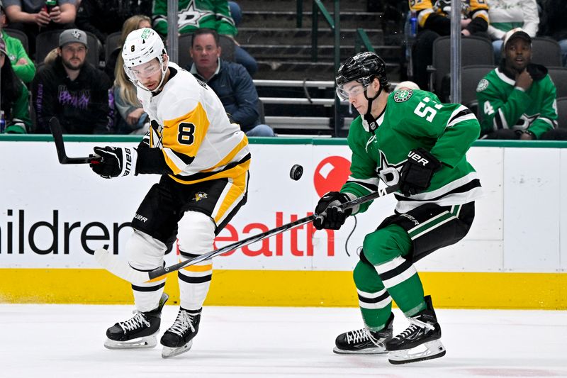 Mar 22, 2024; Dallas, Texas, USA; Pittsburgh Penguins left wing Michael Bunting (8) and Dallas Stars center Wyatt Johnston (53) chase the puck during the first period at the American Airlines Center. Mandatory Credit: Jerome Miron-USA TODAY Sports