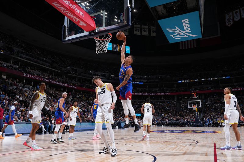 DENVER, CO - MARCH 9: Michael Porter Jr. #1 of the Denver Nuggets dunks the ball during the game against the Utah Jazz on March 9, 2024 at the Ball Arena in Denver, Colorado. NOTE TO USER: User expressly acknowledges and agrees that, by downloading and/or using this Photograph, user is consenting to the terms and conditions of the Getty Images License Agreement. Mandatory Copyright Notice: Copyright 2024 NBAE (Photo by Garrett Ellwood/NBAE via Getty Images)