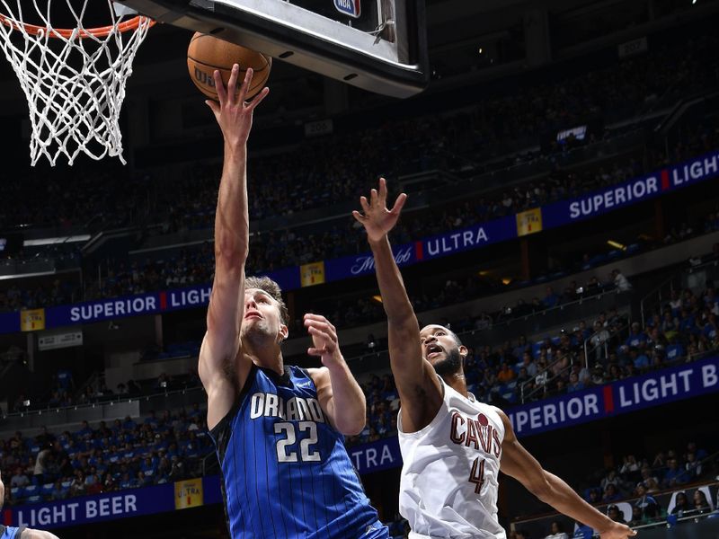 ORLANDO, FL - APRIL 27: Franz Wagner #22 of the Orlando Magic drives to the basket during the game against the Cleveland Cavaliers during Round 1 Game 4 of the 2024 NBA Playoffs on April 27, 2024 at the Kia Center in Orlando, Florida. NOTE TO USER: User expressly acknowledges and agrees that, by downloading and or using this photograph, User is consenting to the terms and conditions of the Getty Images License Agreement. Mandatory Copyright Notice: Copyright 2024 NBAE (Photo by Fernando Medina/NBAE via Getty Images)