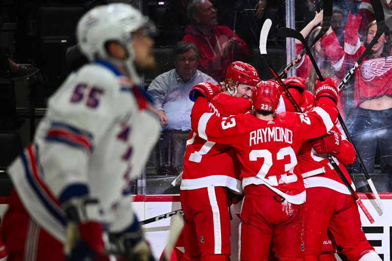 Apr 5, 2024; Detroit, Michigan, USA; New York Rangers defenseman Ryan Lindgren (55) looks on as Detroit Red Wings left wing J.T. Compher (37) celebrates his goal with teammates during the second period at Little Caesars Arena. Mandatory Credit: Tim Fuller-USA TODAY Sports