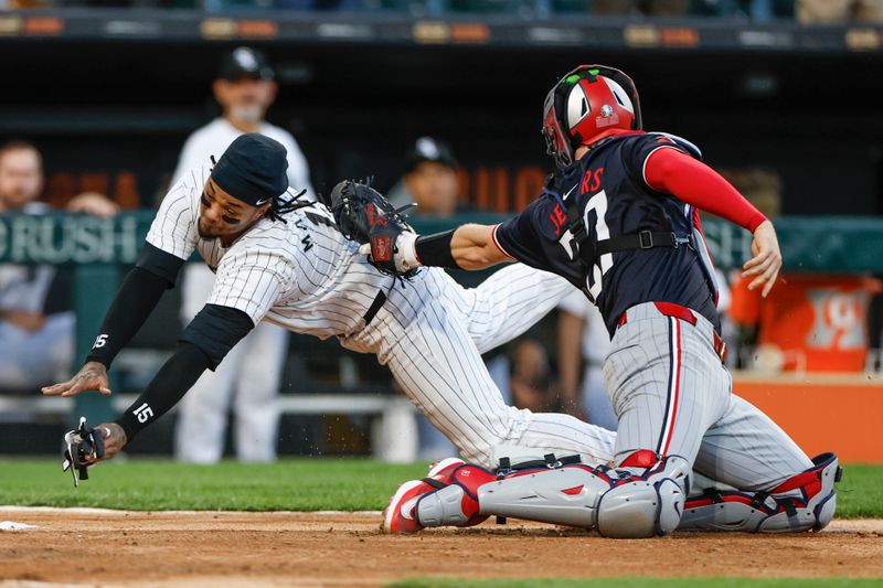 Apr 30, 2024; Chicago, Illinois, USA; Chicago White Sox catcher Martín Maldonado (15) is tagged out by Minnesota Twins catcher Ryan Jeffers (27) at home plate during the third inning at Guaranteed Rate Field. Mandatory Credit: Kamil Krzaczynski-USA TODAY Sports