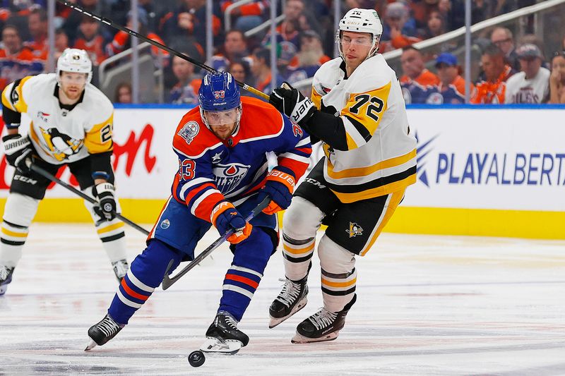 Oct 25, 2024; Edmonton, Alberta, CAN; Edmonton Oilers forward Victor Arvidsson (33) and Pittsburgh Penguins forward Anthony Beauvillier (72) battles for position during the second period at Rogers Place. Mandatory Credit: Perry Nelson-Imagn Images