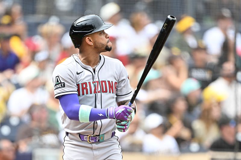Sep 28, 2025; San Diego, California, USA; Arizona Diamondbacks second baseman Ketel Marte (4) hits a solo home run during the first inning against the San Diego Padres at Petco Park. Mandatory Credit: Denis Poroy-Imagn Images