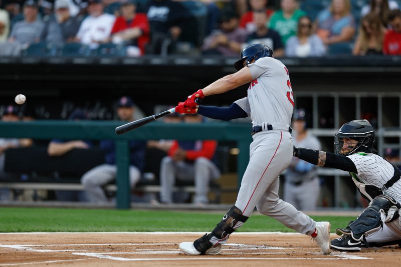 Jun 6, 2024; Chicago, Illinois, USA; Boston Red Sox outfielder Rob Refsnyder (30) doubles against the Chicago White Sox during the first inning at Guaranteed Rate Field. Mandatory Credit: Kamil Krzaczynski-USA TODAY Sports