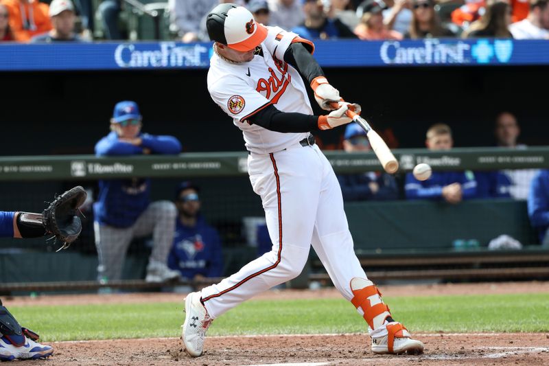 Apr 13, 2025; Baltimore, Maryland, USA; Baltimore Orioles first base Ryan Mountcastle (6) reaches first base on a fielding error by Toronto Blue Jays shortstop Bo Bichette (11) during the sixth inning at Oriole Park at Camden Yards. Mandatory Credit: Daniel Kucin Jr.-Imagn Images