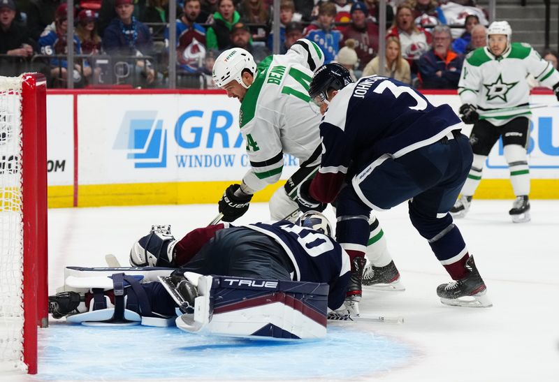 Feb 27, 2024; Denver, Colorado, USA; Dallas Stars left wing Jamie Benn (14) attempts to score on Colorado Avalanche goaltender Alexandar Georgiev (40) and defenseman Jack Johnson (3) in the first period at Ball Arena. Mandatory Credit: Ron Chenoy-USA TODAY Sports