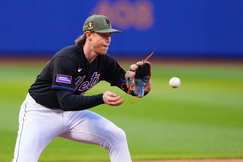 May 21, 2023; New York City, New York, USA;  New York Mets third baseman Brett Baty (22) fields a ground ball hit by Cleveland Guardians designated hitter Amed Rosario (1) (not pictured) during the first inning at Citi Field. Mandatory Credit: Gregory Fisher-USA TODAY Sports