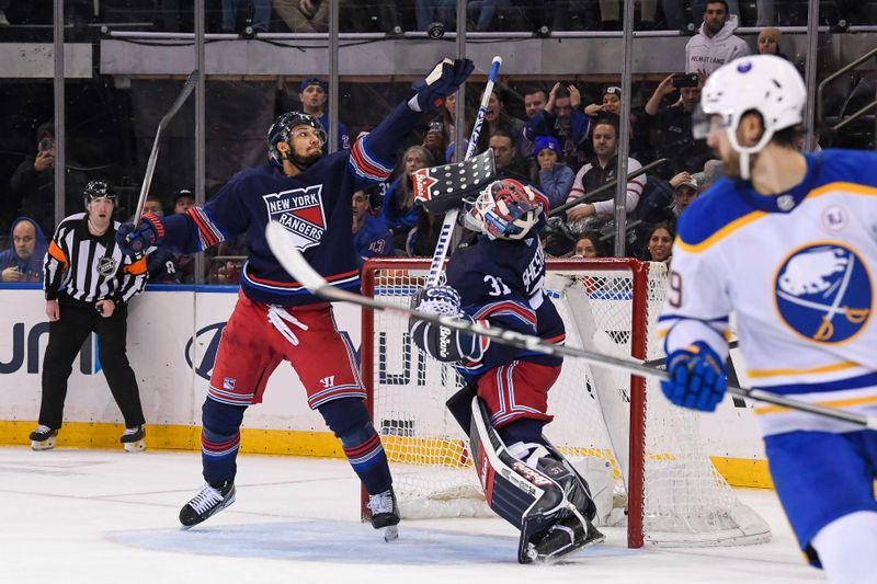 Dec 23, 2023; New York, New York, USA; New York Rangers goaltender Igor Shesterkin (31) New York Rangers defenseman K'Andre Miller (79) make a save against the Buffalo Sabres during overtime period at Madison Square Garden. Mandatory Credit: Dennis Schneidler-USA TODAY Sports