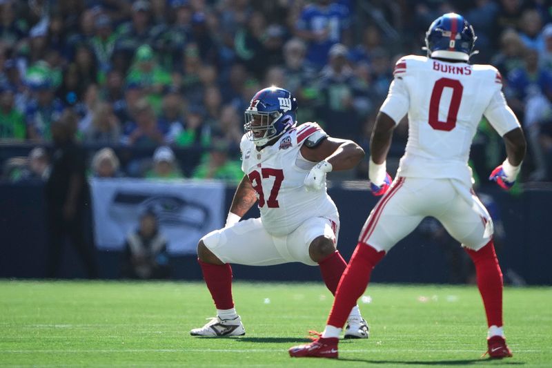 New York Giants defensive tackle Dexter Lawrence II (97) celebrates after sacking Seattle Seahawks quarterback Geno Smith (7) during the first half of an NFL football game, Sunday, Oct. 6, 2024, in Seattle. (AP Photo/Lindsey Wasson)