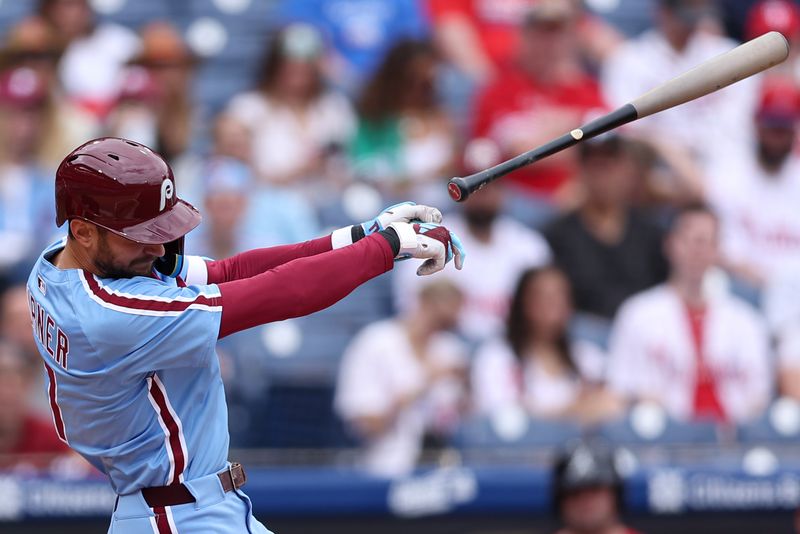 May 29, 2025; Philadelphia, Pennsylvania, USA; Philadelphia Phillies shortstop Trea Turner (7) looses control of his bat while swinging for a pitch during the first inning against the Atlanta Braves at Citizens Bank Park. Mandatory Credit: Bill Streicher-Imagn Images