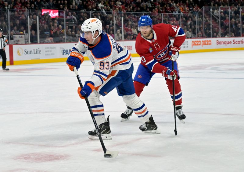 Nov 18, 2024; Montreal, Quebec, CAN; Edmonton Oilers forward Ryan Nugent-Hopkins (93) takes a shot and Montreal Canadiens forward Joel Armia (40) defends during the third period at the Bell Centre. Mandatory Credit: Eric Bolte-Imagn Images