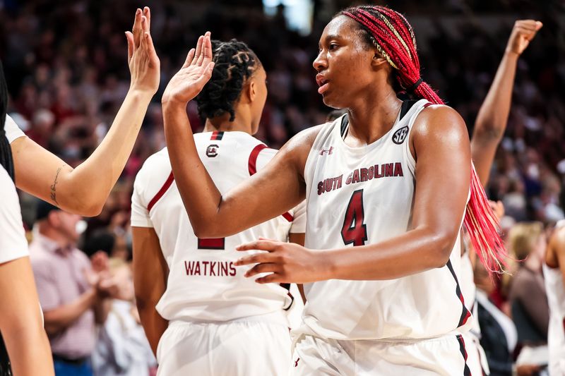 Feb 26, 2023; Columbia, South Carolina, USA; South Carolina Gamecocks forward Aliyah Boston (4) high fives her teammates after leaving the game against the Georgia Lady Bulldogs in the second half at Colonial Life Arena. Mandatory Credit: Jeff Blake-USA TODAY Sports