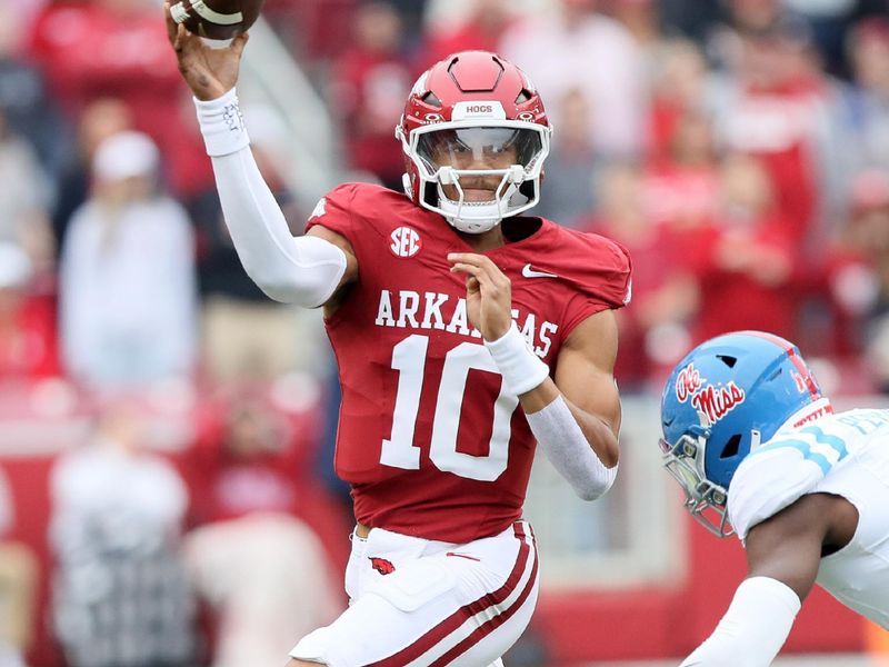 Nov 2, 2024; Fayetteville, Arkansas, USA; Arkansas Razorbacks quarterback Taylen Green (10) passes in the first quarter against the Ole Miss Rebels at Donald W. Reynolds Razorback Stadium. Mandatory Credit: Nelson Chenault-Imagn Images