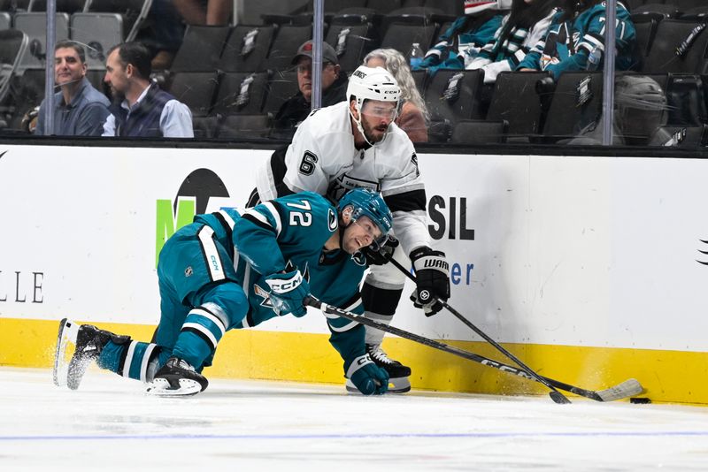 Oct 29, 2024; San Jose, California, USA; Los Angeles Kings defenseman Joel Edmundson (6) and San Jose Sharks left wing William Eklund (72) battle for the puck in the first period at SAP Center at San Jose. Mandatory Credit: Eakin Howard-Imagn Images
