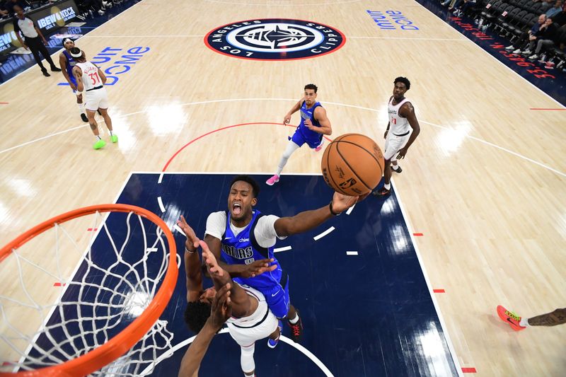 INGLEWOOD, CA - OCTOBER 14: Olivier Maxence-Prosper #8 of the Dallas Mavericks drives to the basket during the game against the LA Clippers during a NBA Preseason game on October 14, 2024 at the Intuit Dome in Inglewood, California. NOTE TO USER: User expressly acknowledges and agrees that, by downloading and/or using this Photograph, user is consenting to the terms and conditions of the Getty Images License Agreement. Mandatory Copyright Notice: Copyright 2024 NBAE (Photo by Adam Pantozzi/NBAE via Getty Images)