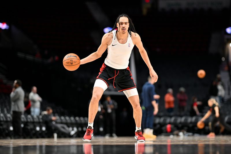 PORTLAND, OREGON - FEBRUARY 15: Dalano Banton #5 of the Portland Trail Blazers warms up before the game against the Minnesota Timberwolves at the Moda Center on February 15, 2024 in Portland, Oregon. NOTE TO USER: User expressly acknowledges and agrees that, by downloading and or using this photograph, User is consenting to the terms and conditions of the Getty Images License Agreement. (Photo by Alika Jenner/Getty Images)