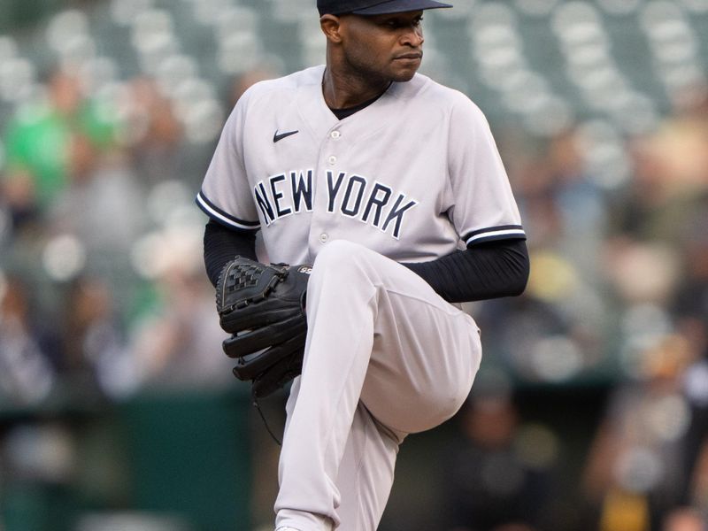 Jun 28, 2023; Oakland, California, USA;  New York Yankees starting pitcher Domingo German (0) pitches during the first inning against the Oakland Athletics at Oakland-Alameda County Coliseum. Mandatory Credit: Stan Szeto-USA TODAY Sports