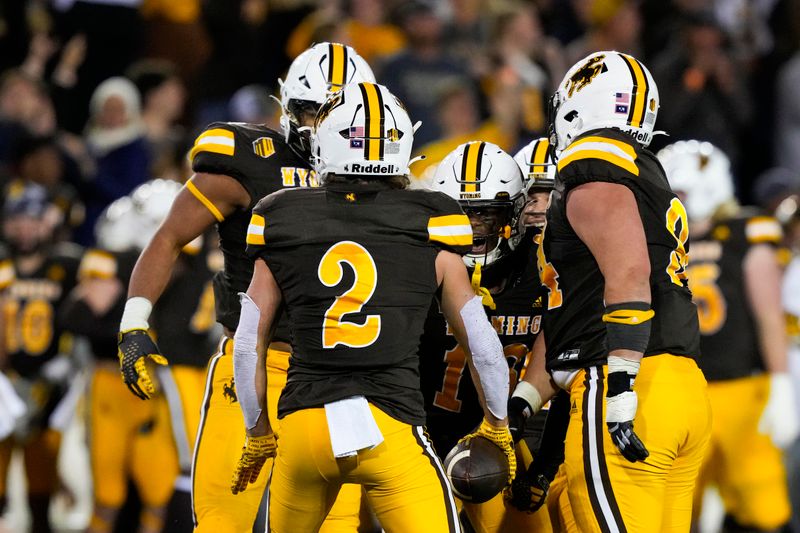 Sep 23, 2023; Laramie, Wyoming, USA; Wyoming Cowboys nose guard Wrook Brown (2) celebrates an interception against the Appalachian State Mountaineers during the fourth quarter at Jonah Field at War Memorial Stadium. Mandatory Credit: Troy Babbitt-USA TODAY Sports