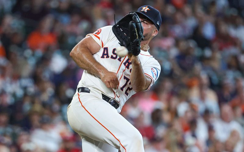 Jun 5, 2024; Houston, Texas, USA; Houston Astros relief pitcher Nick Hernandez (72) attempts to field a batted ball during the ninth inning against the St. Louis Cardinals at Minute Maid Park. Mandatory Credit: Troy Taormina-USA TODAY Sports