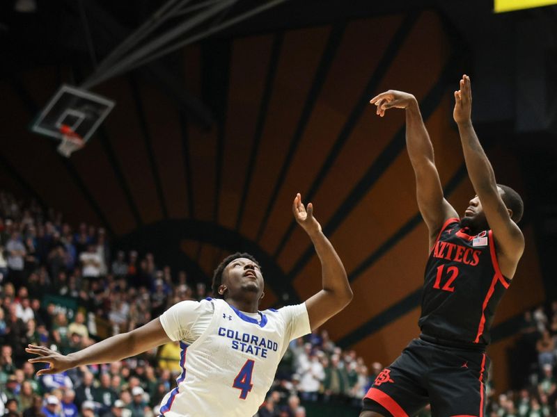 Jan 30, 2024; Fort Collins, Colorado, USA; San Diego State Aztecs guard Darrion Trammell (12) shoots a basket over Colorado State Rams guard Isaiah Stevens (4) in the first half at Moby Arena. Mandatory Credit: Chet Strange-USA TODAY Sports