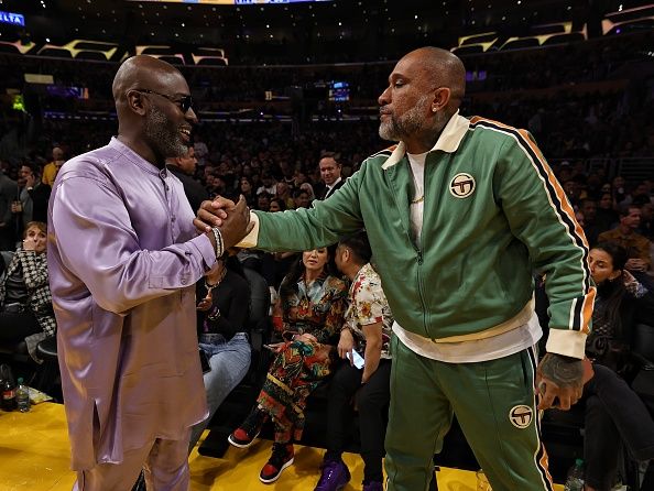 LOS ANGELES, CA - NOVEMBER 1:  Corey Gamble & Kenya Barris embrace during the game on November 1, 2023 at Crypto.Com Arena in Los Angeles, California. NOTE TO USER: User expressly acknowledges and agrees that, by downloading and/or using this Photograph, user is consenting to the terms and conditions of the Getty Images License Agreement. Mandatory Copyright Notice: Copyright 2023 NBAE (Photo by Jim Poorten/NBAE via Getty Images)