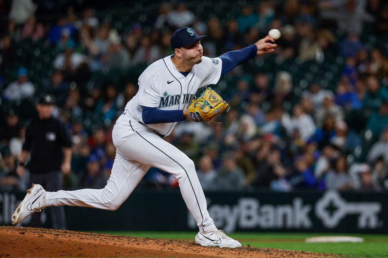 Jun 13, 2023; Seattle, Washington, USA; Seattle Mariners relief pitcher Tayler Saucedo (60) throws against the Miami Marlins during the ninth inning at T-Mobile Park. Mandatory Credit: Joe Nicholson-USA TODAY Sports