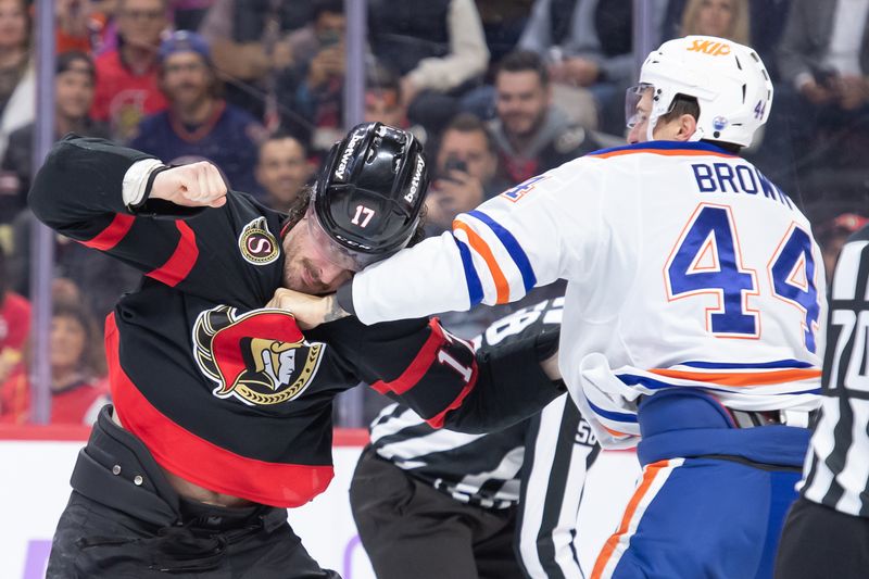Nov 19, 2024; Ottawa, Ontario, CAN; Ottawa Senators right wing Zack MacEwen (17) fights with Edmonton Oilers defenseman Joshua Brown (44) in the first period at the Canadian Tire Centre. Mandatory Credit: Marc DesRosiers-Imagn Images