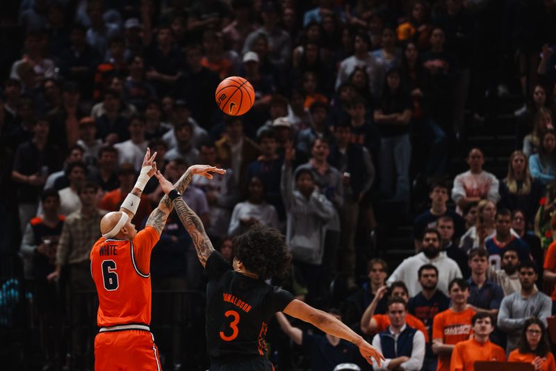Feb 21, 2026; Charlottesville, Virginia, USA; Virginia Cavaliers guard Jacari White (6) shoots the ball while Miami (FL) Hurricanes guard Tre Donaldson (3) defends during the first half at John Paul Jones Arena. Mandatory Credit: Emily Faith Morgan-Imagn Images