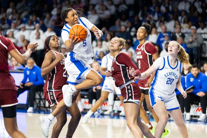 Mar 1, 2026; Lexington, Kentucky, USA; Kentucky Wildcats guard Tonie Morgan (5) jumps for a basket during the third quarter at Memorial Coliseum. Mandatory Credit: Arden Barnes-Imagn Images
