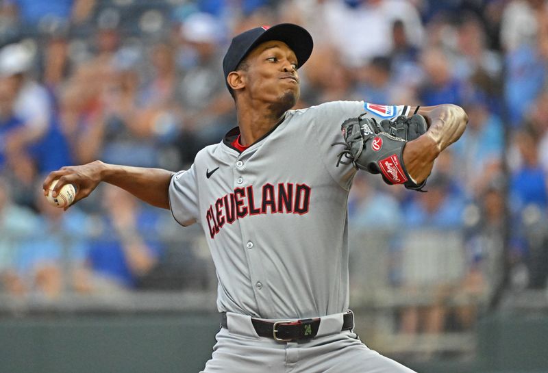 Jun 28, 2024; Kansas City, Missouri, USA;  Cleveland Guardians starting pitcher Triston McKenzie (24) delivers a pitch in the first inning against the Kansas City Royals at Kauffman Stadium. Mandatory Credit: Peter Aiken-USA TODAY Sports