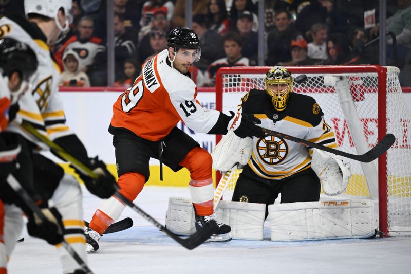 Nov 2, 2024; Philadelphia, Pennsylvania, USA; Philadelphia Flyers right wing Garnet Hathaway (19) looks to deflect a shot against Boston Bruins goalie Joonas Korpisalo (70) in the second period at Wells Fargo Center. Mandatory Credit: Kyle Ross-Imagn Images