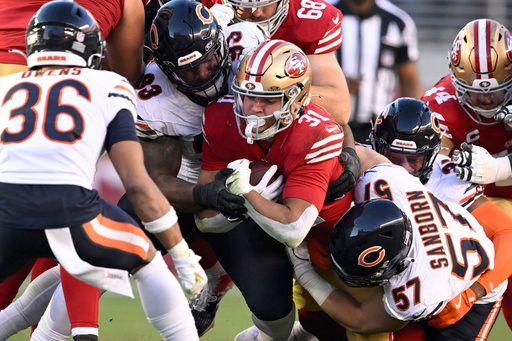 San Francisco 49ers running back Isaac Guerendo (31) is tackled against the Chicago Bears during the second half of an NFL football game in Santa Clara, Calif., Sunday, Dec. 8, 2024. (AP Photo/Eakin Howard)