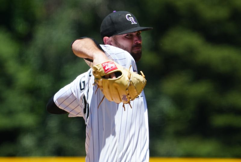 Jun 25, 2023; Denver, Colorado, USA; Colorado Rockies starting pitcher Austin Gomber (26) delivers a pitch in the first inning against the Los Angeles Angels at Coors Field. Mandatory Credit: Ron Chenoy-USA TODAY Sports