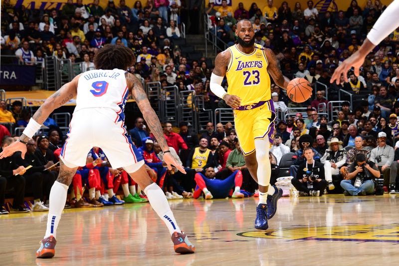 LOS ANGELES, CA - NOVEMBER 8: LeBron James #23 of the Los Angeles Lakers dribbles the ball during the game against the Philadelphia 76ers on Novemberr 8, 2024 at Crypto.Com Arena in Los Angeles, California. NOTE TO USER: User expressly acknowledges and agrees that, by downloading and/or using this Photograph, user is consenting to the terms and conditions of the Getty Images License Agreement. Mandatory Copyright Notice: Copyright 2024 NBAE (Photo by Adam Pantozzi/NBAE via Getty Images)