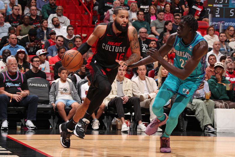 MIAMI, FL - JANUARY 14: Caleb Martin #16 of the Miami Heat drives to the basket during the game against the Charlotte Hornets on January 14, 2024 at Kaseya Center in Miami, Florida. NOTE TO USER: User expressly acknowledges and agrees that, by downloading and or using this Photograph, user is consenting to the terms and conditions of the Getty Images License Agreement. Mandatory Copyright Notice: Copyright 2024 NBAE (Photo by Issac Baldizon/NBAE via Getty Images)