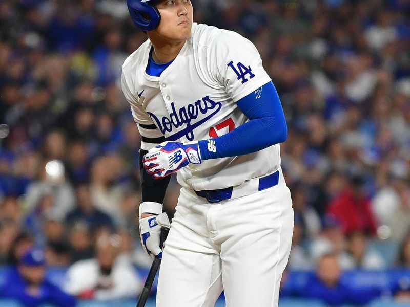 May 31, 2024; Los Angeles, California, USA; Los Angeles Dodgers designated hitter Shohei Ohtani (17) reacts while hitting against the Colorado Rockies during the sixth inning at Dodger Stadium. Mandatory Credit: Gary A. Vasquez-USA TODAY Sports