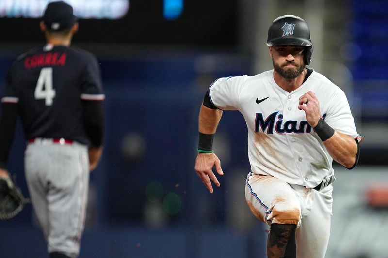 Apr 4, 2023; Miami, Florida, USA;  Miami Marlins third baseman Jon Berti (5) tags-up and advances to third base on a fly ball in the sixth inning against the Minnesota Twinsat loanDepot Park. Mandatory Credit: Jim Rassol-USA TODAY Sports