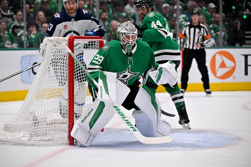 May 13, 2025; Dallas, Texas, USA; Dallas Stars goaltender Jake Oettinger (29) faces the Winnipeg Jets attack during the first period in game four of the second round of the 2025 Stanley Cup Playoffs at American Airlines Center. Mandatory Credit: Jerome Miron-Imagn Images