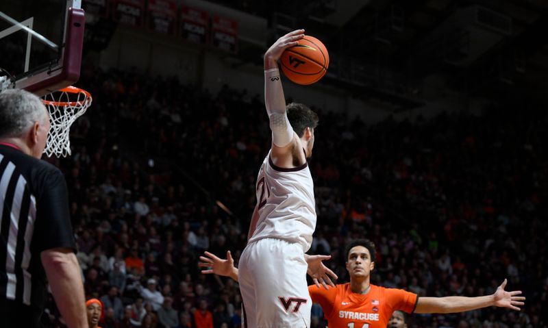 Jan 28, 2023; Blacksburg, Virginia, USA; Virginia Tech Hokies forward Grant Basile (21) keeps ball away from Syracuse Orange center Jesse Edwards (14) in the second half at Cassell Coliseum. Mandatory Credit: Lee Luther Jr.-USA TODAY Sports