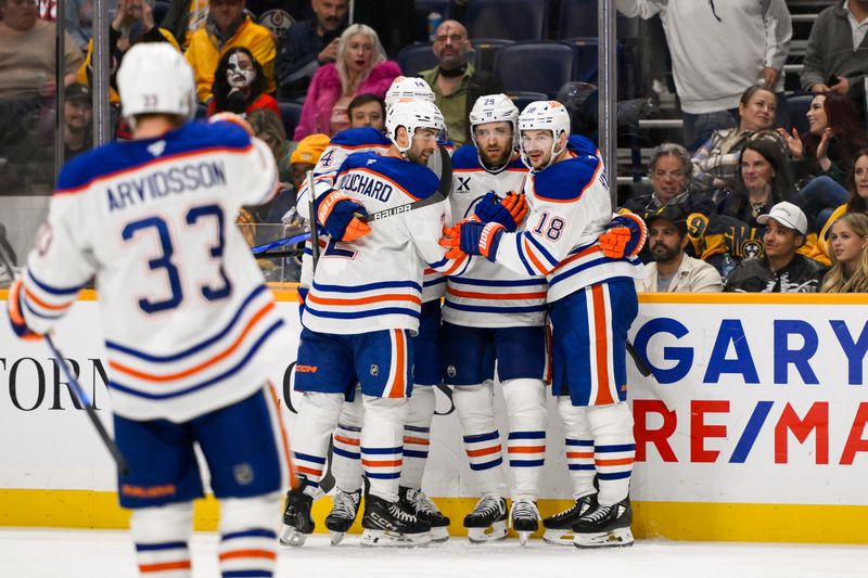 Oct 31, 2024; Nashville, Tennessee, USA;  Edmonton Oilers center Leon Draisaitl (29) celebrates with teammates after his goal against the Nashville Predators during the second period at Bridgestone Arena. Mandatory Credit: Steve Roberts-Imagn Images