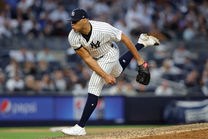 Apr 1, 2023; Bronx, New York, USA; New York Yankees relief pitcher Jimmy Cordero (70) follows through on a pitch against the San Francisco Giants during the ninth inning at Yankee Stadium. Mandatory Credit: Brad Penner-USA TODAY Sports