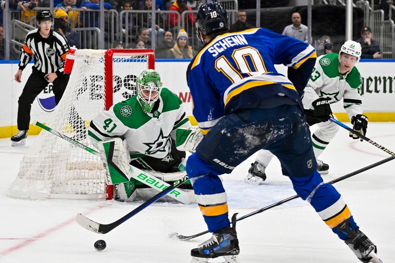 Dec 27, 2023; St. Louis, Missouri, USA;  Dallas Stars goaltender Scott Wedgewood (41) defends the net against St. Louis Blues center Brayden Schenn (10) during the second period at Enterprise Center. Mandatory Credit: Jeff Curry-USA TODAY Sports