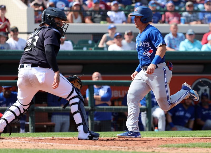 Mar 4, 2023; Lakeland, Florida, USA; Toronto Blue Jays infielder Andres Sosa (72) scores a run against the Detroit Tigers during the fourth inning at Publix Field at Joker Marchant Stadium. Mandatory Credit: Kim Klement-USA TODAY Sports