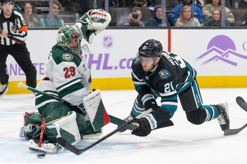 Nov 7, 2024; San Jose, California, USA;  San Jose Sharks center Alexander Wennberg (21) shoots during the second period against Minnesota Wild goaltender Marc-Andre Fleury (29) at SAP Center at San Jose. Mandatory Credit: Stan Szeto-Imagn Images