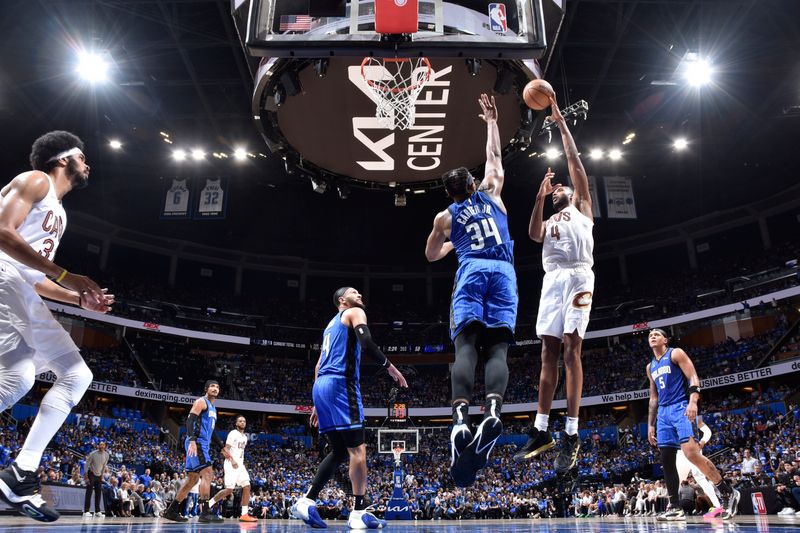 ORLANDO, FL - APRIL 25: Evan Mobley #4 of the Cleveland Cavaliers goes to the basket during the game against the Orlando Magic during Round 1 Game 3 of the 2024 NBA Playoffs on April 25, 2024 at Kia Center in Orlando, Florida. NOTE TO USER: User expressly acknowledges and agrees that, by downloading and or using this photograph, User is consenting to the terms and conditions of the Getty Images License Agreement. Mandatory Copyright Notice: Copyright 2023 NBAE (Photo by Fernando Medina/NBAE via Getty Images)