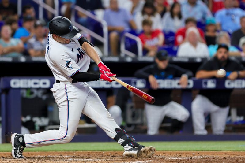 Jul 30, 2023; Miami, Florida, USA; Miami Marlins catcher Nick Fortes (4) hits an RBI double against the Detroit Tigers during the fifth inning at loanDepot Park. Mandatory Credit: Sam Navarro-USA TODAY Sports