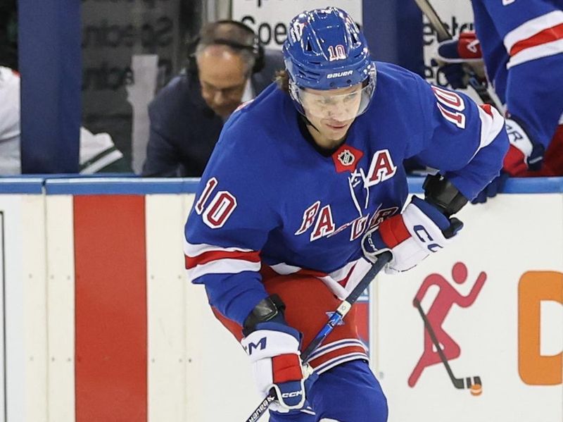 Apr 2, 2025; New York, New York, USA;  New York Rangers left wing Artemi Panarin (10) controls the puck in the second period against the Minnesota Wild at Madison Square Garden. Mandatory Credit: Wendell Cruz-Imagn Images
